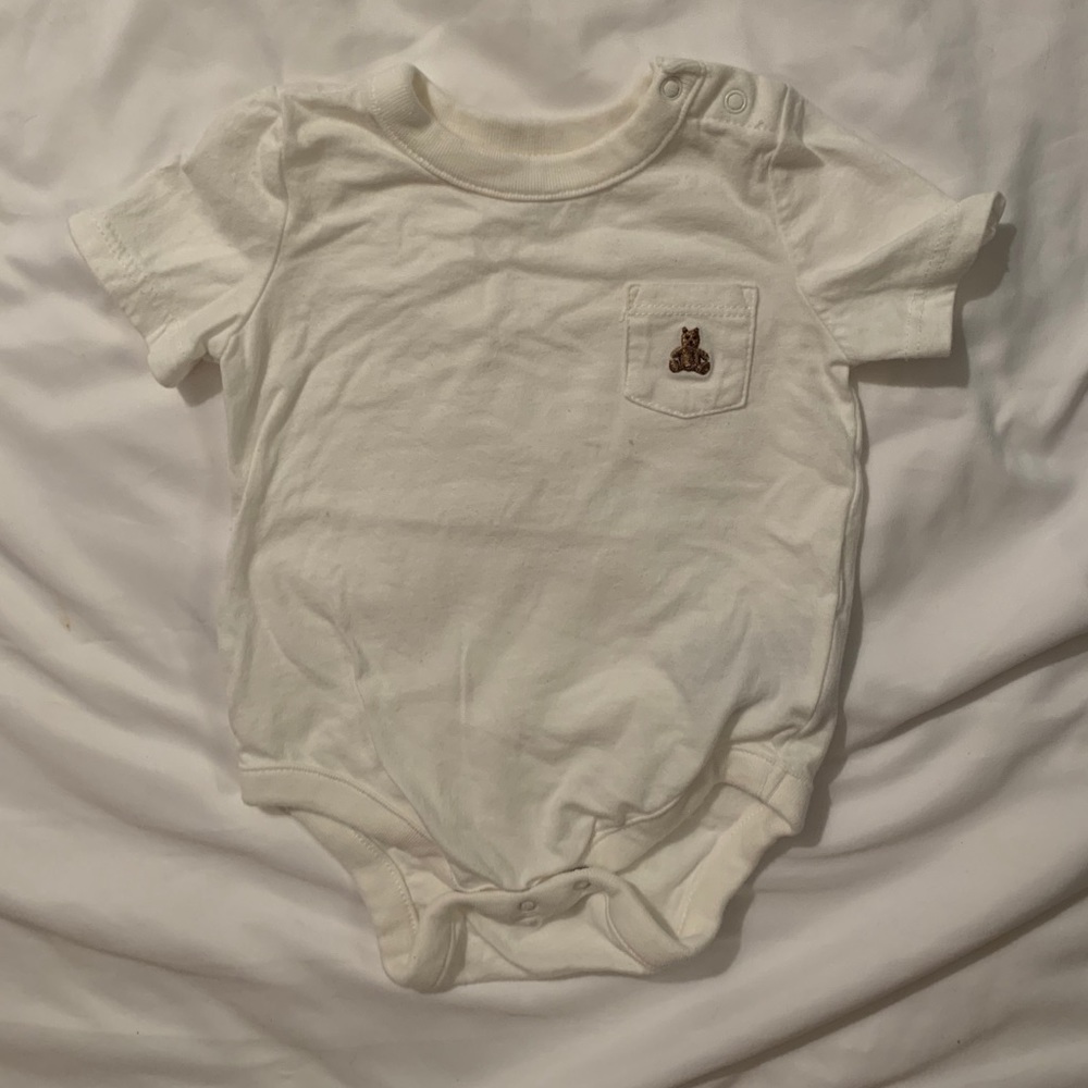 White onesie with bear logo
